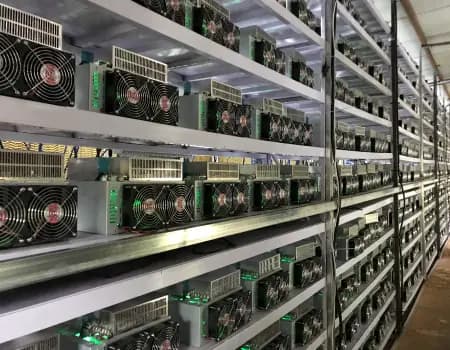 Rows of ASIC miners installed in metal racks